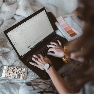 Woman composing an email on a laptop